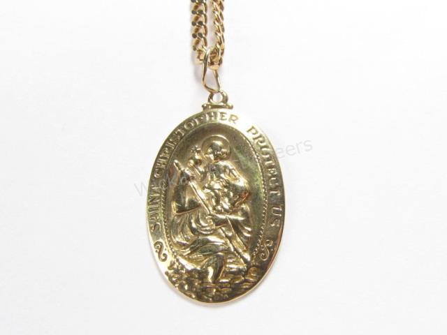 Appraisal: A K yellow gold St Christopher x medallion on a