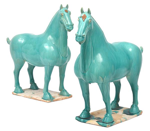 Appraisal: A PAIR OF TURQUOISE GLAZED TANG STYLE EARTHENWARE HORSES cm