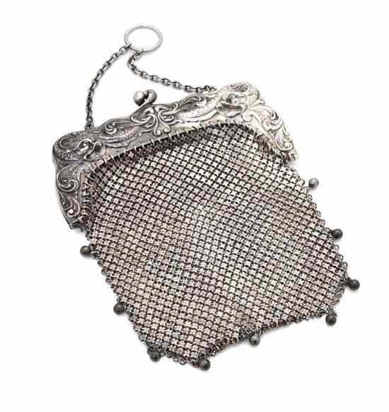 Appraisal: A Sterling Silver Mesh Purse having a dolphin and scrolling