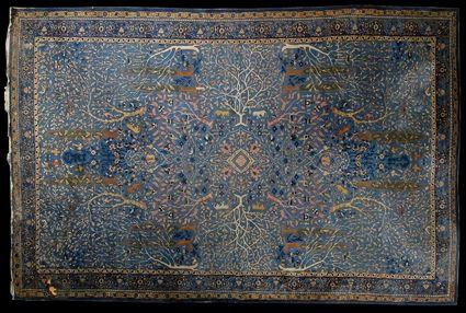 Appraisal: PERSIAN ANIMAL CARPET The light blue field worked with cypress