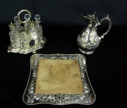 Appraisal: A bread board with plated stand a cruet of six