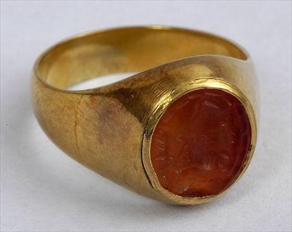 Appraisal: EARLY PERSIAN CARNELIAN INTAGLIO SET IN A GOLD RING Size