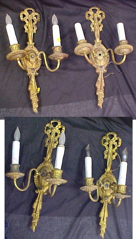 Appraisal: Four matching gilt cast metal wall sconces bow and tassels