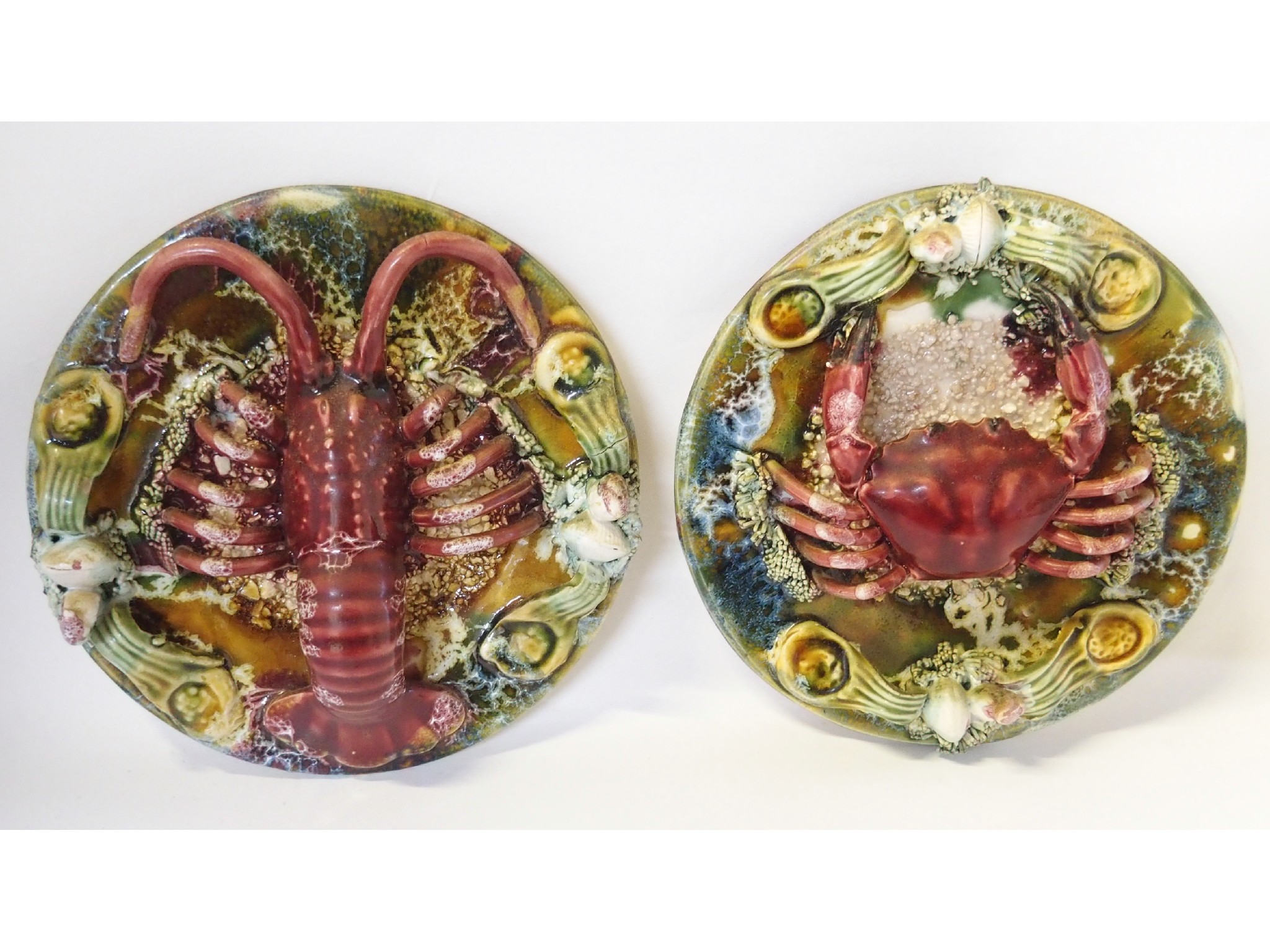 Appraisal: Two Palissy style plates one decorated in relief with a