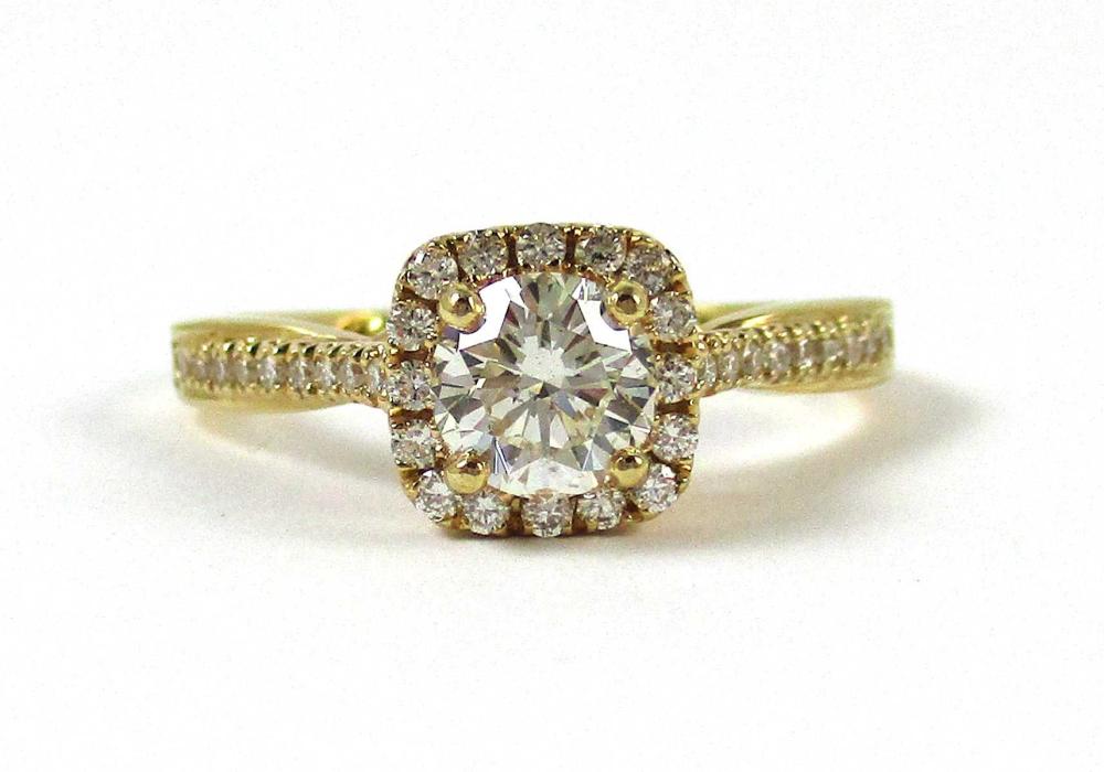 Appraisal: DIAMOND AND FOURTEEN KARAT GOLD RING with ct round-cut center