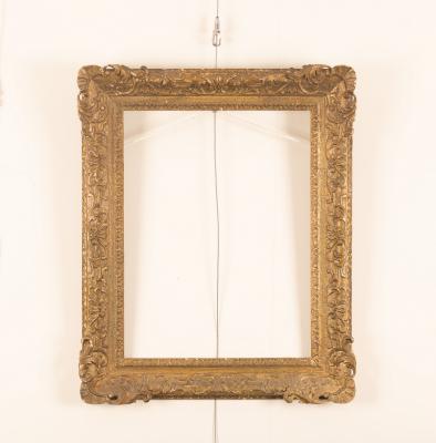 Appraisal: A picture frame with gesso moulded acanthus and c scrolls