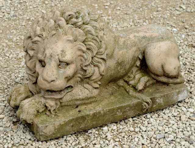 Appraisal: AN ANTIQUE TERRACOTTA COMPOSITION STONE RECUMBENT LION long x high