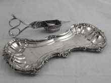 Appraisal: A pair of close plated silver snuffers on plated tray