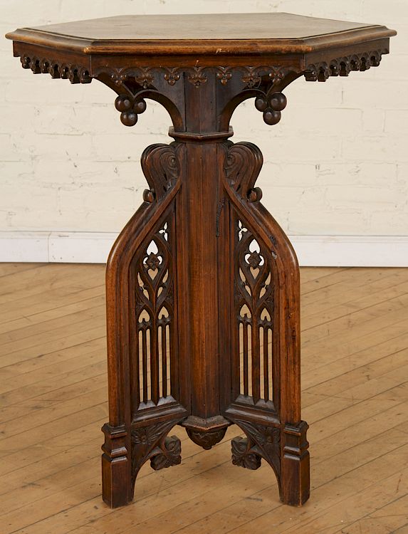 Appraisal: GOTHIC STYLE CARVED WALNUT OCCASIONAL TABLE A Gothic style carved