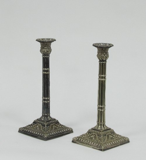 Appraisal: A pair of Sheffield plate candlesticks with cluster columns on