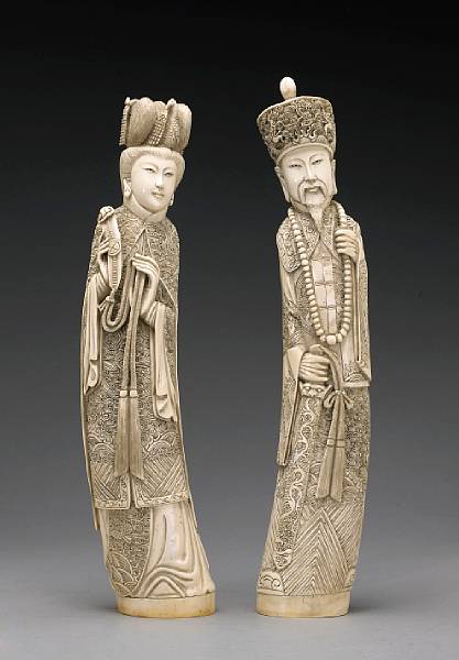 Appraisal: A pair of tinted ivory standing emperor and empress figures