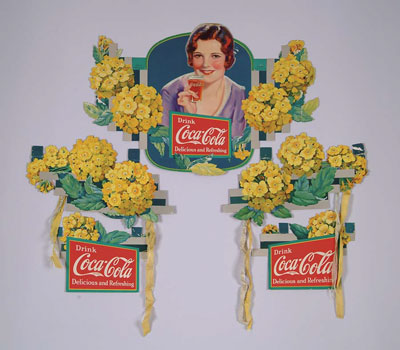 Appraisal: SCARCE COCA-COLA CARDBOARD FESTOON This desirable old cardboard die-cut Verbena