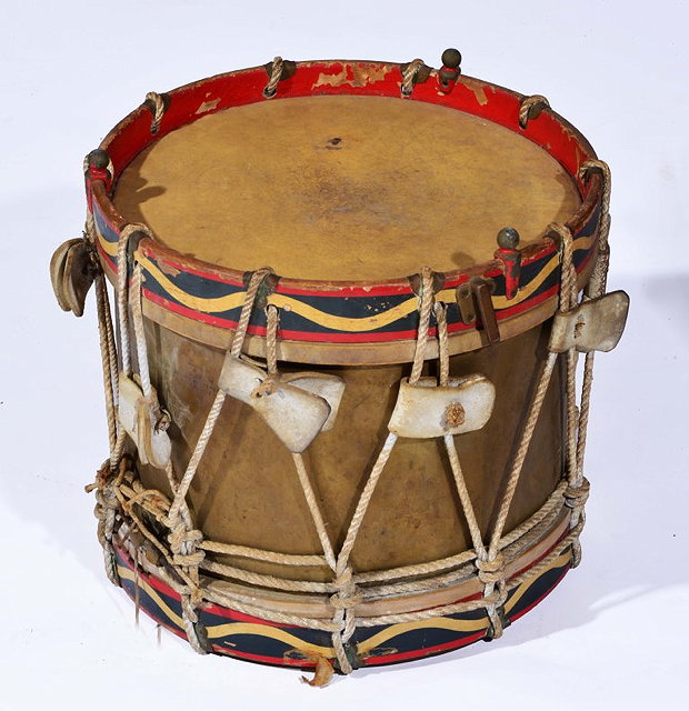 Appraisal: A MILITARY BRASS DRUM with painted timber borders and rope-twist