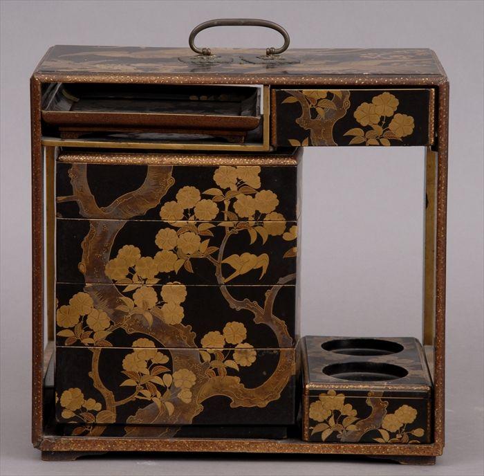 Appraisal: JAPANESE LACQUER PICNIC SET Decorated with blossoming branches incorporating a