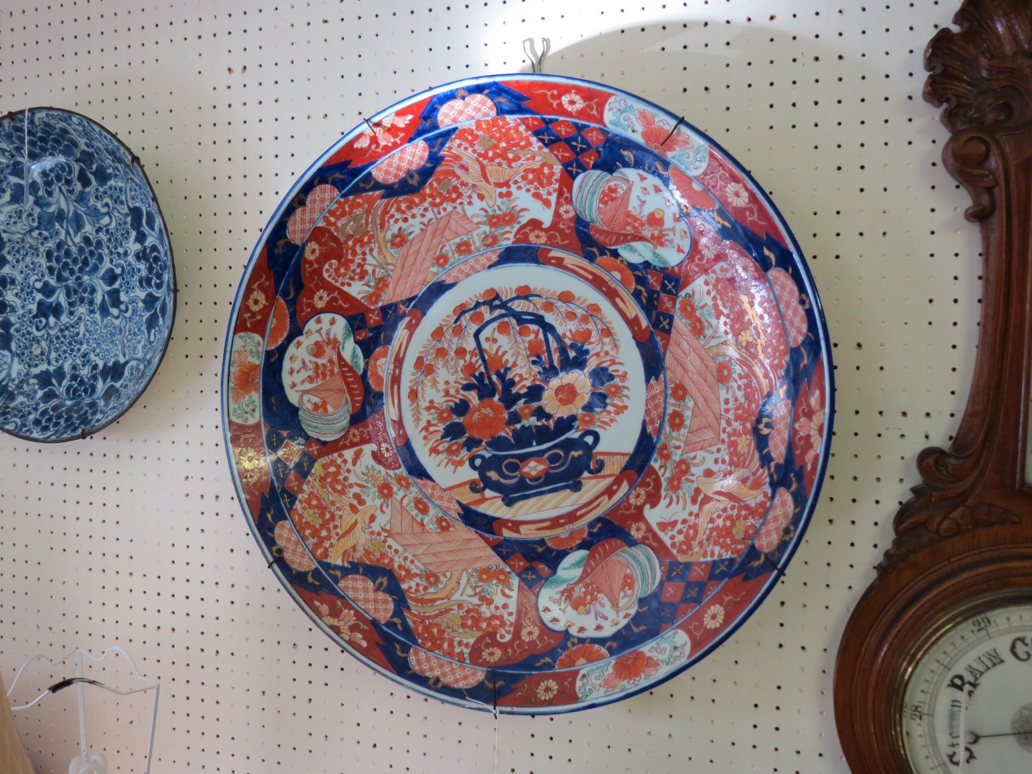 Appraisal: A large Imari wall plate painted in traditional colours with