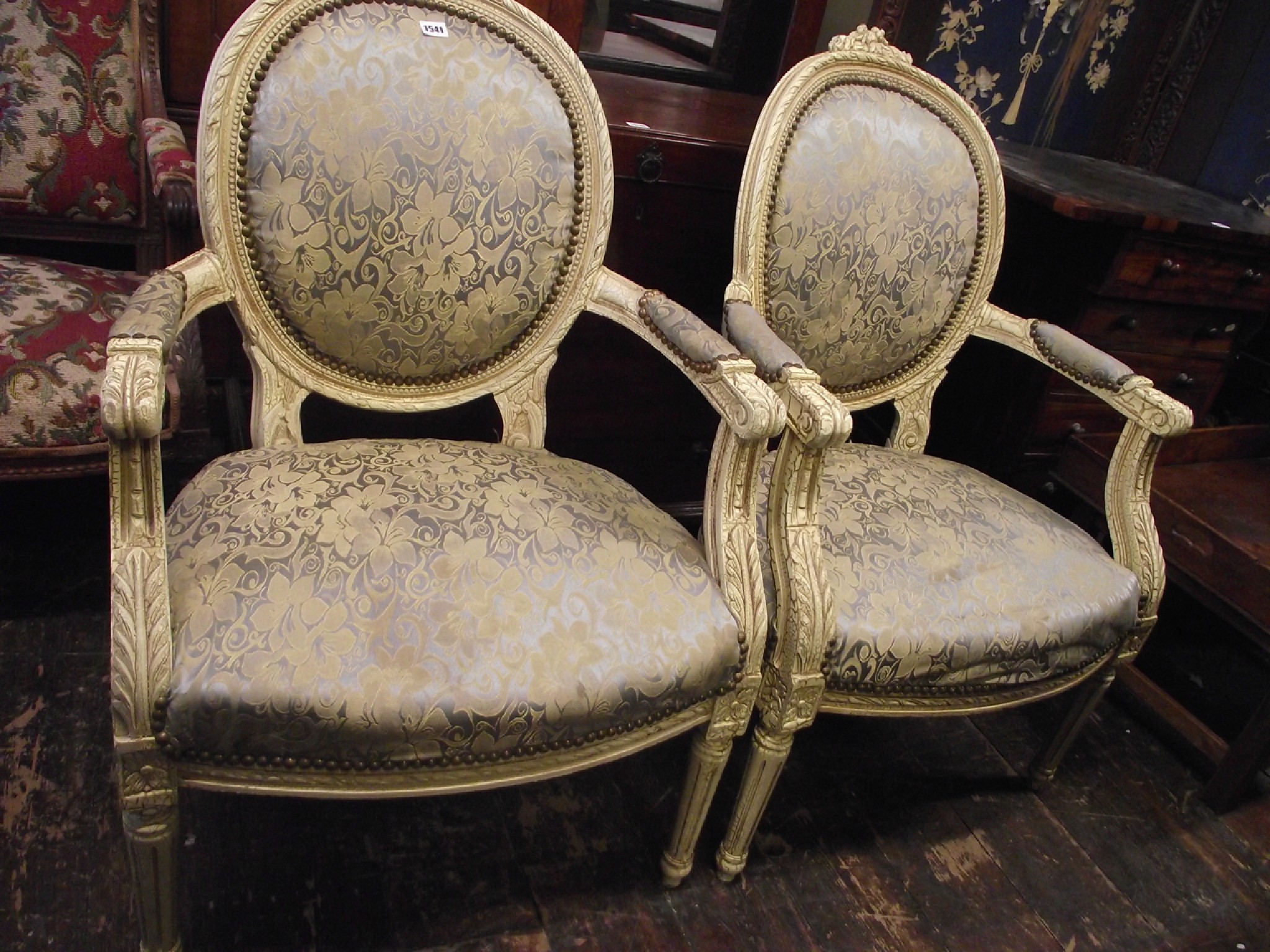 Appraisal: A pair of French open armchairs with cameo backs upholstered