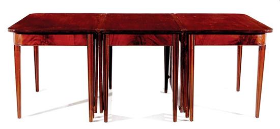 Appraisal: American mahogany three-part dining table late th century D-ends and