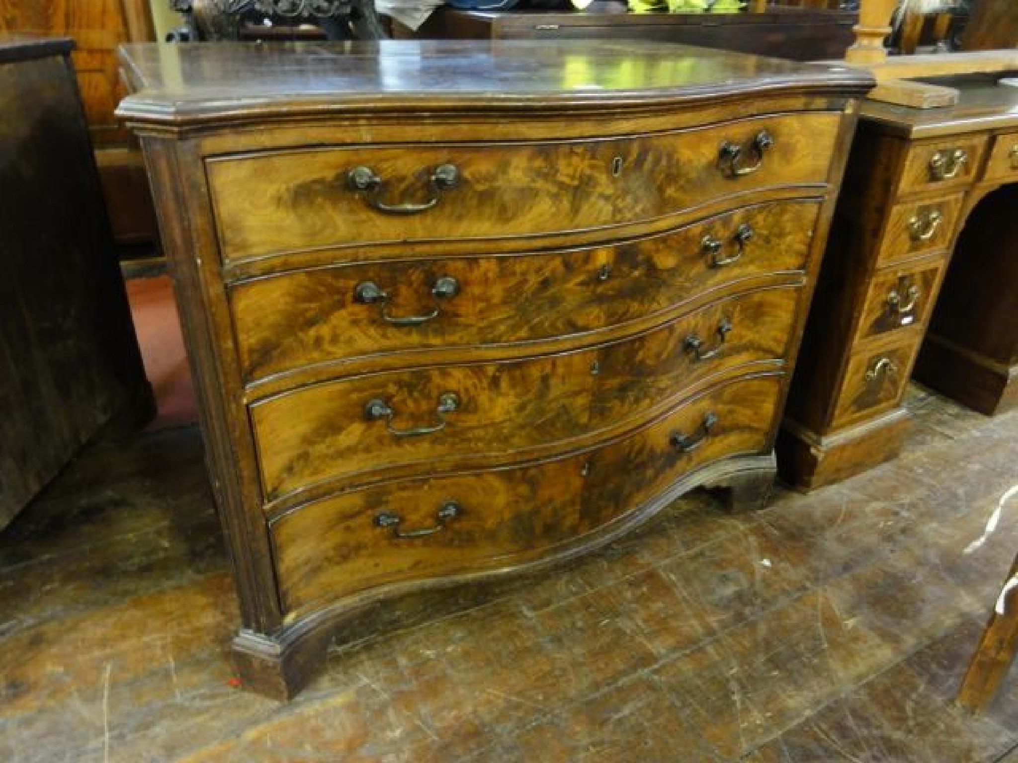 Appraisal: A Georgian mahogany chest of four long graduated drawers with