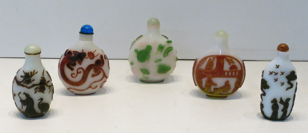 Appraisal: FIVE CHINESE PEKING GLASS SNUFF BOTTLES individually cameo carved in