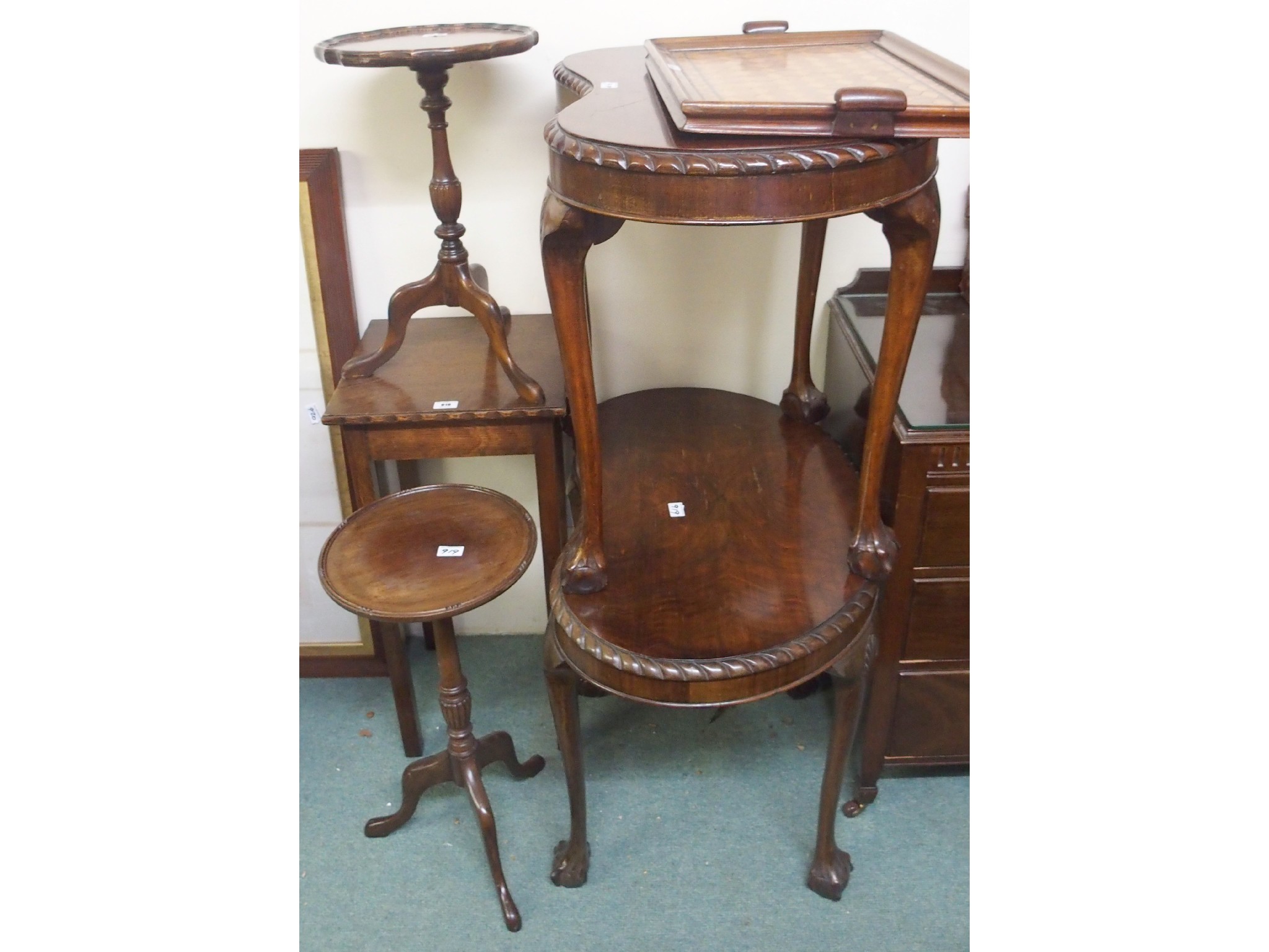 Appraisal: A pair of kidney shaped occasional tables two wine tables