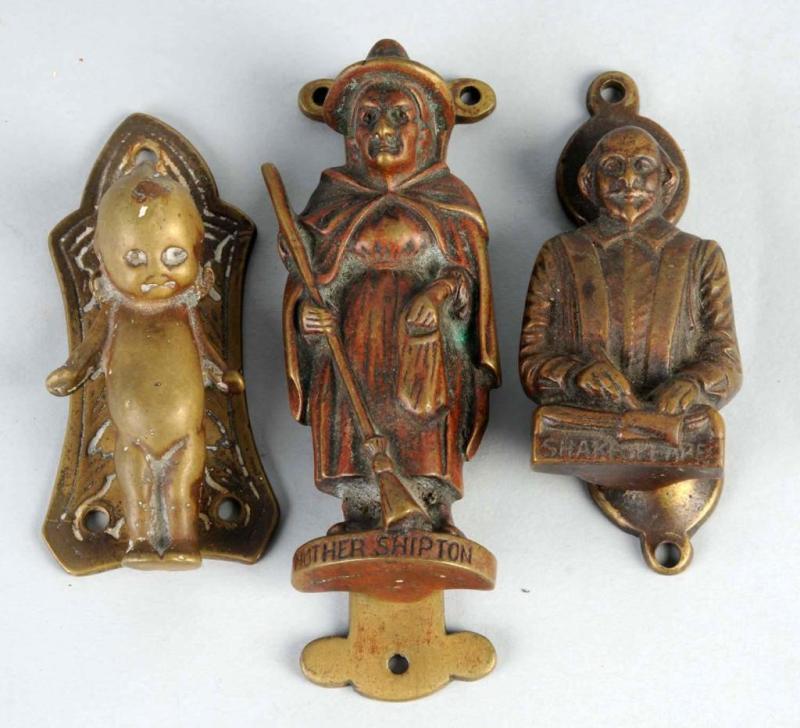 Appraisal: Lot of Cast Brass Figural Doorknockers Description English Condition Excellent