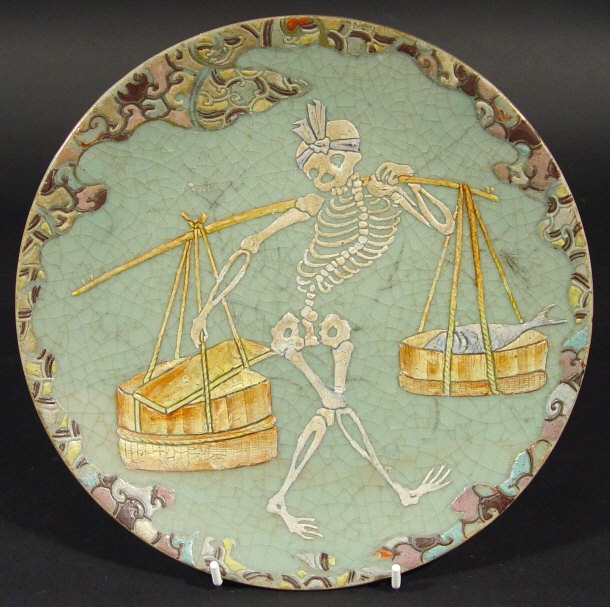 Appraisal: Japanese crackle glazed plate enamelled with a skeleton clutching food