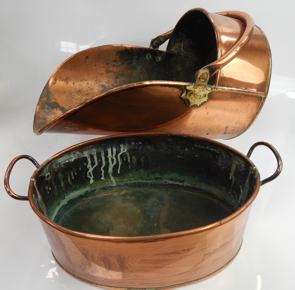 Appraisal: A Victorian copper coal scuttle and an oval copper two