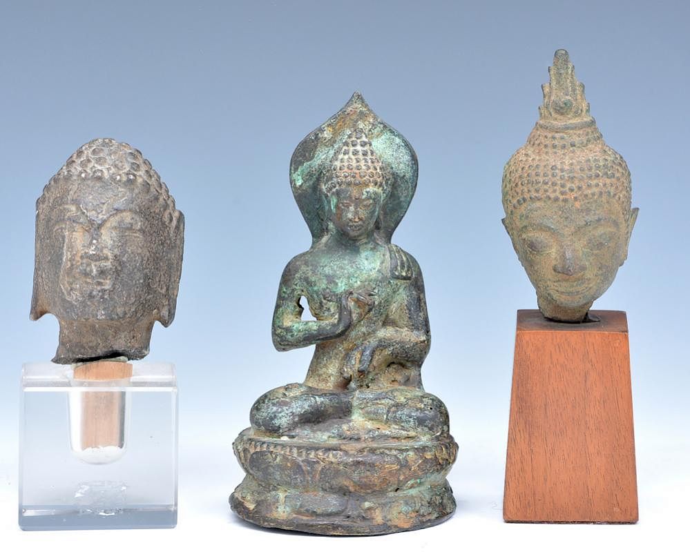 Appraisal: Buddha heads and statue Buddha heads one of stone and