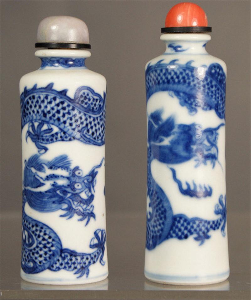 Appraisal: Cylindrical porcelain snuff bottles with blue underglaze dragon seeking flaming