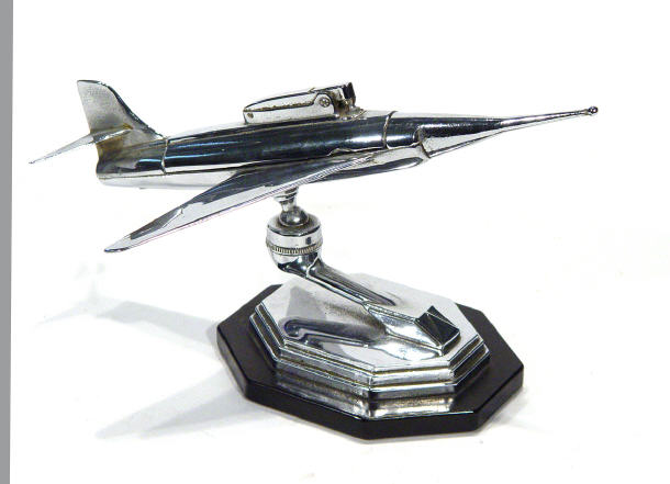 Appraisal: s style chrome rocket design table lighter on a black