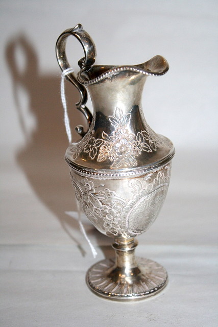 Appraisal: A GEORGE III MINIATURE SILVER EWER with beaded decoration double