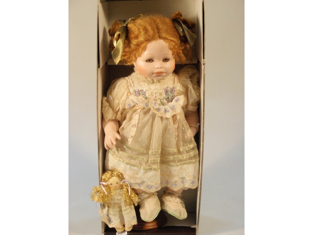 Appraisal: A Mundia ceramic doll 'Margot et sa poup e with