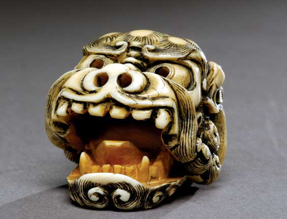 Appraisal: CARVED IVORY NETSUKE Large and well carved ivory netsuke of