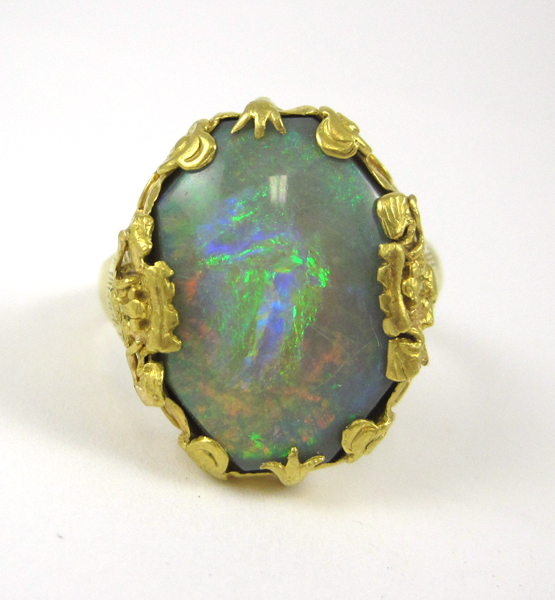 Appraisal: MAN'S OPAL AND TWENTY-TWO KARAT GOLD RING featuring a large