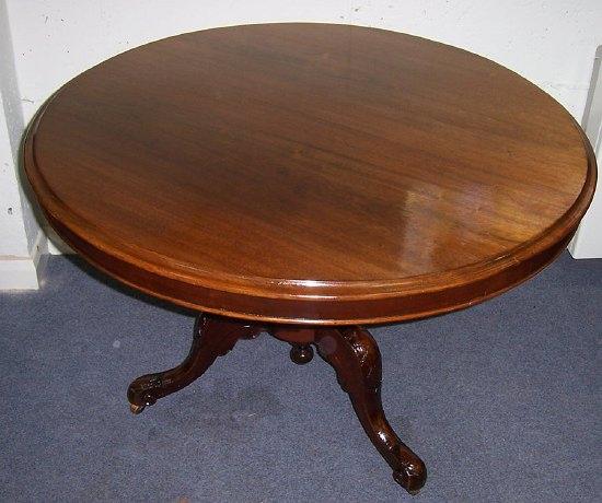 Appraisal: A mahogany tilt top table the circular top on a