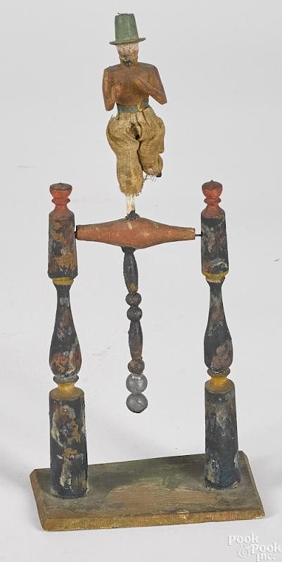 Appraisal: Erzgebirge carved wood balance dancing toy Erzgebirge carved and painted