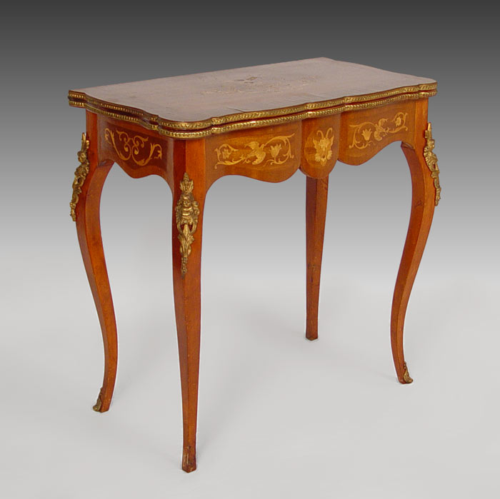 Appraisal: FRENCH MARQUETRY GAME TABLE Ormolu mounts including cherubic masquerons Eagle