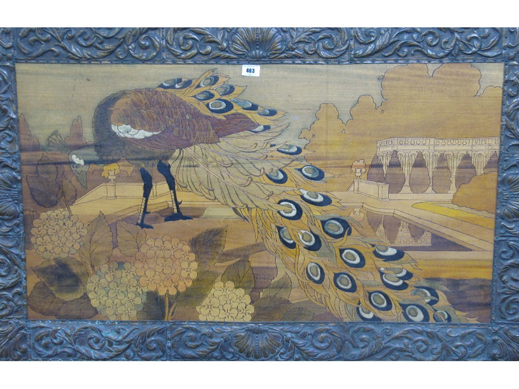 Appraisal: Pokerwork with penwork panel of a peacock in repousse metal