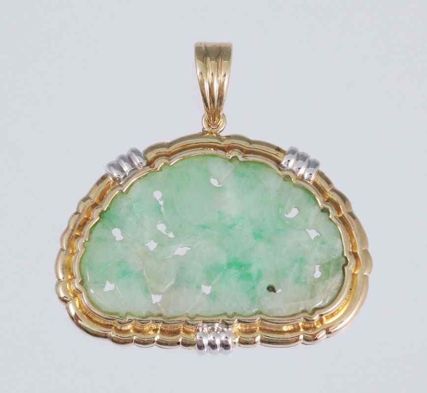 Appraisal: CARVED FLORAL JADEITE JADE K GOLD PENDANT Framed in K