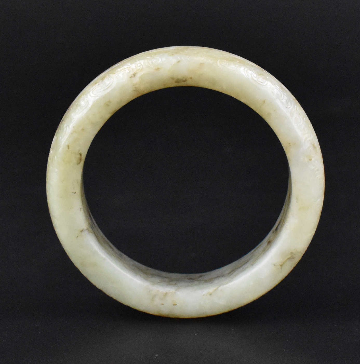 Appraisal: A Chinese greyish white jade bangle dating from the qing