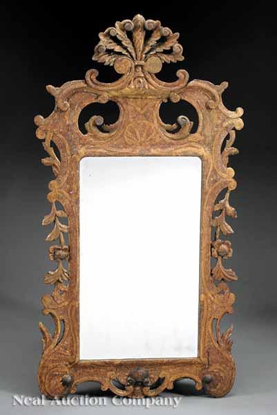 Appraisal: A George II Carved and Giltwood Looking Glass mid- th