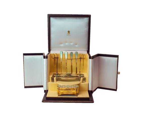 Appraisal: A lady's silver gilt and enameled dressing table set comprising