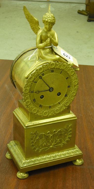 Appraisal: French ormolu drumhead two train mantel clock the movement with