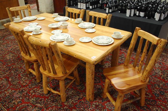 Appraisal: JUNIPER LOG DINING TABLE AND CHAIR SET American made recent