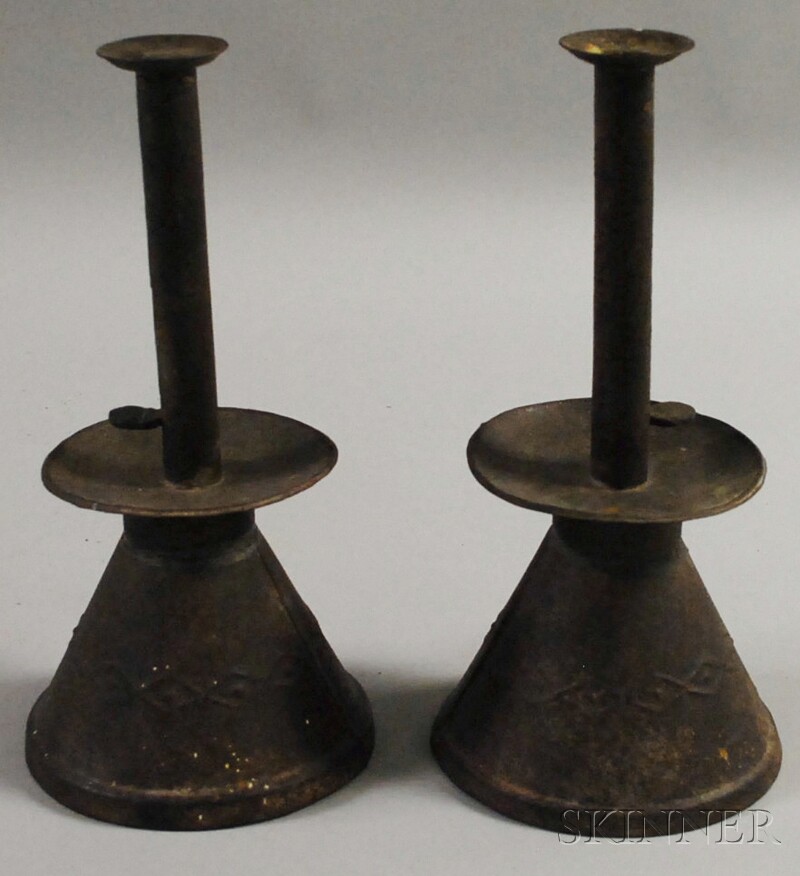 Appraisal: Pair of Embossed Sheet Iron Push-up Candlesticks with embossed diamond