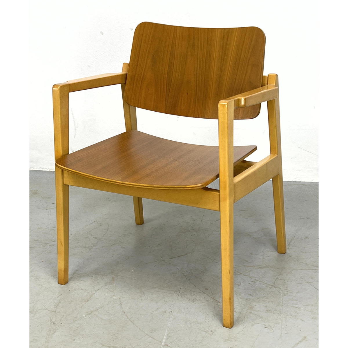 Appraisal: Jens Risom executive bent plywood walnut and maple armchair Partial