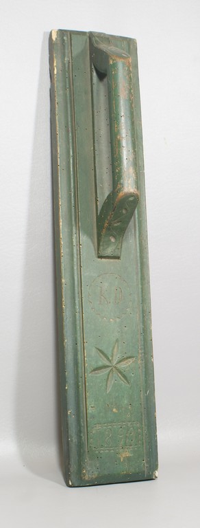 Appraisal: Carved and green painted smoothing board marked KD - long