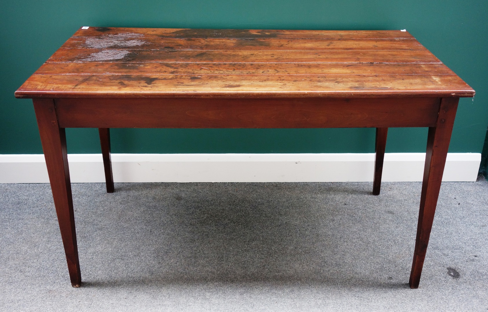 Appraisal: A th century French plank top kitchen table on tapering