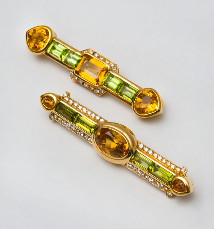 Appraisal: TWO K GOLD CITRINE AND PERIDOT BAR BROOCHES Set with