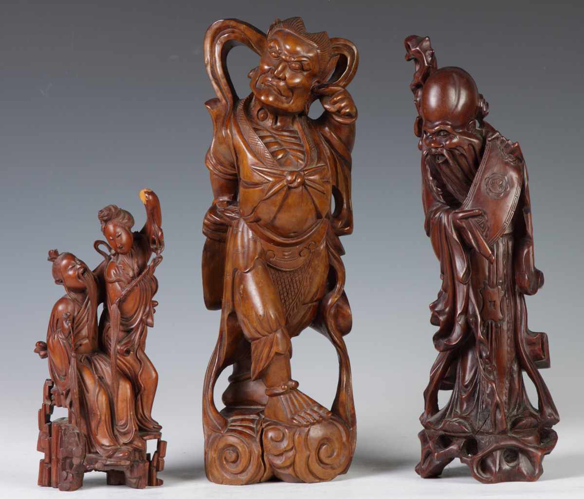 Appraisal: Carved Wood Figures L to R break to hand Ht